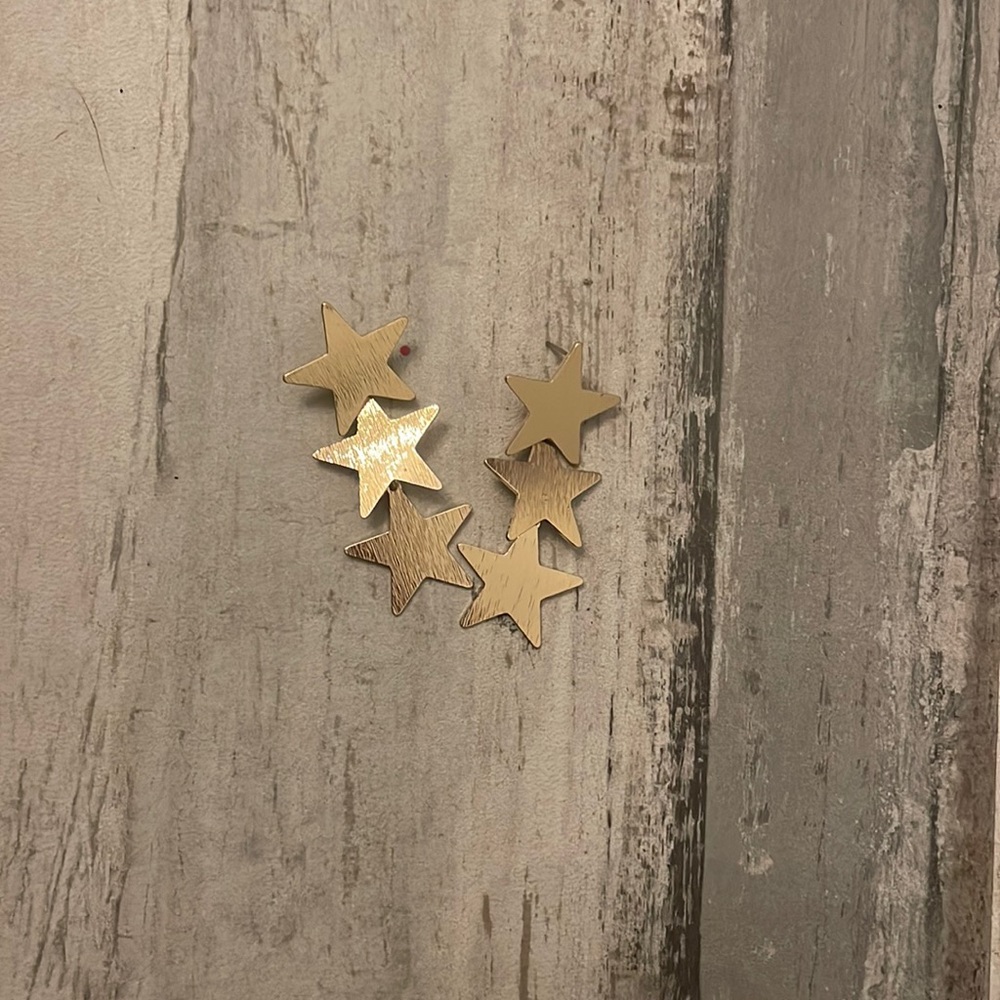 alterd state gold star dangle earrings